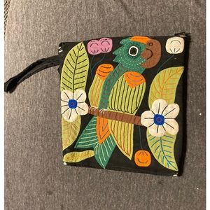 Mola art from Panama on a small bag with black cloth handle.  Handmade.
